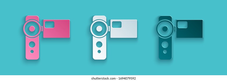 Papier schneiden Cinema Kamera Symbol einzeln auf blauem Hintergrund. Videokamera. Filmzeichen. Filmprojektor. Kunststil aus Papier. Vektorillustration-Illustration