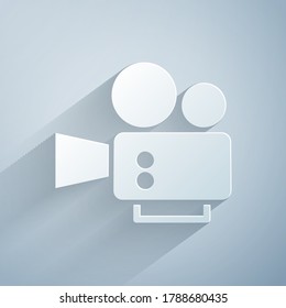 Paper cut Cinema camera icon isolated on grey background. Video camera. Movie sign. Film projector. Paper art style. Vector
