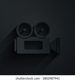 Paper cut Cinema camera icon isolated on black background. Video camera. Movie sign. Film projector. Paper art style. Vector Illustration
