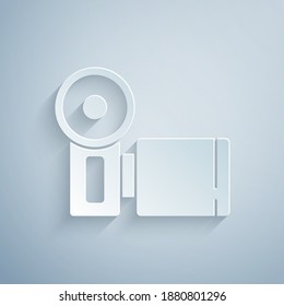 Paper cut Cinema camera icon isolated on grey background. Video camera. Movie sign. Film projector. Paper art style. Vector.