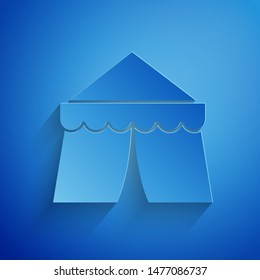 Paper cut Circus tent icon isolated on blue background. Carnival camping tent. Amusement park. Paper art style. Vector Illustration