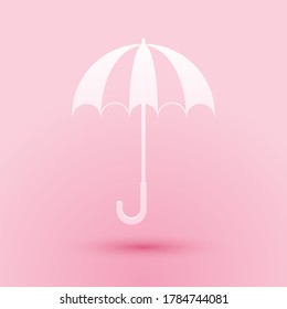 Paper cut Classic elegant opened umbrella icon isolated on pink background. Rain protection symbol. Paper art style. Vector.