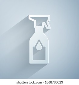 Paper cut Cleaning spray bottle with detergent liquid icon isolated on grey background. Paper art style. Vector