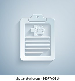 Paper cut Clipboard with medical clinical record pet icon isolated on grey background. Health insurance form. Medical check marks report. Paper art style. Vector Illustration