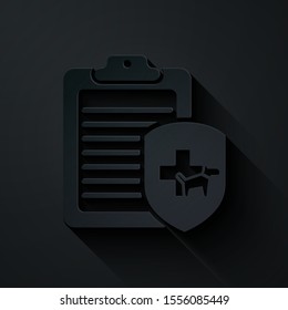 Paper cut Clipboard with medical clinical record pet icon isolated on black background. Health insurance form. Medical check marks report. Paper art style. Vector Illustration