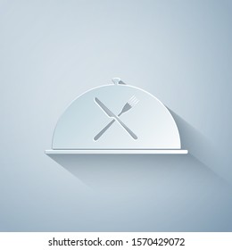Paper cut Cloche with crossed fork and knife icon isolated on grey background. Restaurant symbol. Paper art style. Vector Illustration