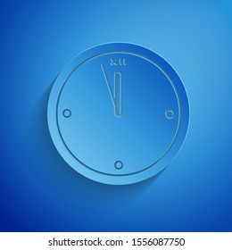 Paper cut Clock icon isolated on blue background. Time symbol. Merry Christmas and Happy New Year. Paper art style. Vector Illustration
