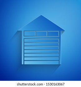 Paper cut Closed warehouse icon isolated on blue background. Paper art style. Vector Illustration