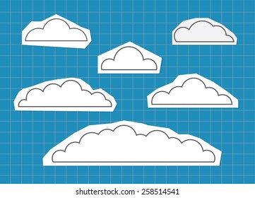 paper cut cloud on blue cutting mat