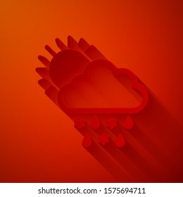 Paper cut Cloud with snow, rain and sun icon isolated on red background. Weather icon. Paper art style. Vector Illustration