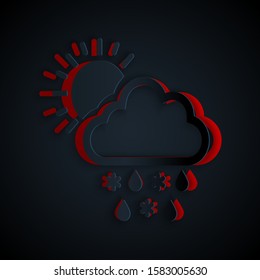 Paper cut Cloud with snow, rain and sun icon isolated on black background. Weather icon. Paper art style. Vector Illustration