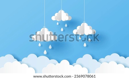 Paper cut of clouds and raindrops  on blue background. Vector illustration
