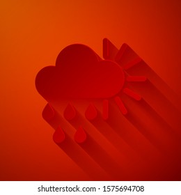 Paper cut Cloudy with rain and sun icon isolated on red background. Rain cloud precipitation with rain drops. Paper art style. Vector Illustration