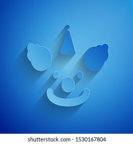 Paper cut Clown head icon isolated on blue background. Paper art style. Vector Illustration