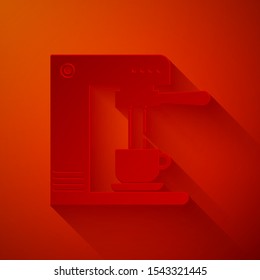 Paper cut Coffee machine and coffee cup icon isolated on red background. Paper art style. Vector Illustration