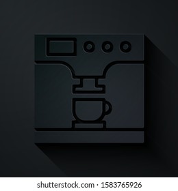 Paper cut Coffee machine and coffee cup icon isolated on black background. Paper art style. Vector Illustration