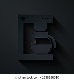 Paper cut Coffee machine with glass pot icon isolated on black background. Paper art style. Vector Illustration