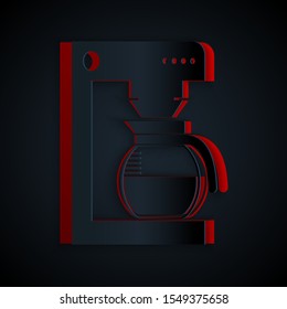 Paper cut Coffee machine with glass pot icon isolated on black background. Paper art style. Vector Illustration