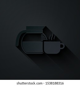 Paper cut Coffee pot with cup icon isolated on black background. Paper art style. Vector Illustration