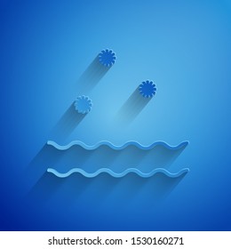Paper cut Cold and waves icon isolated on blue background. Paper art style. Vector Illustration