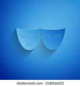 Paper cut Comedy and tragedy theatrical masks icon isolated on blue background. Paper art style. Vector Illustration