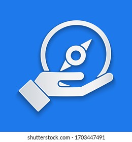 Paper cut Compass icon isolated on blue background. Windrose navigation symbol. Wind rose sign. Paper art style. Vector Illustration