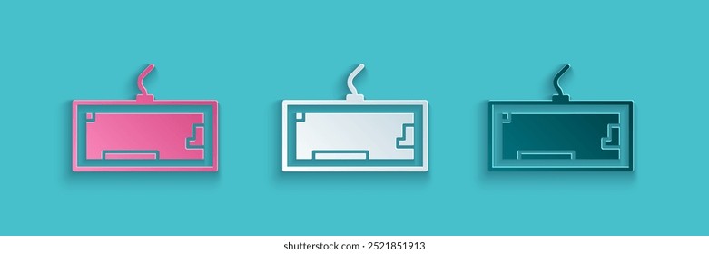 Paper cut Computer keyboard icon isolated on blue background. PC component sign. Paper art style. Vector Illustration