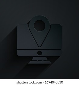 Paper cut Computer monitor and folded map with location marker icon isolated on black background. Paper art style. Vector Illustration