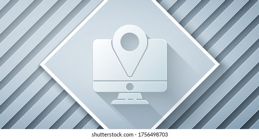 Paper cut Computer monitor and folded map with location marker icon isolated on grey background. Paper art style. Vector Illustration