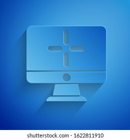 Paper cut Computer monitor icon isolated on blue background. PC component sign. Paper art style. Vector Illustration