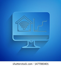 Paper cut Computer monitor with smart home with wi-fi icon isolated on blue background. Remote control. Paper art style. Vector Illustration