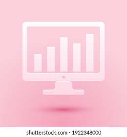 Paper cut Computer screen with financial charts and graphs icon isolated on pink background. Chart bars and financial analytics. Paper art style. Vector.