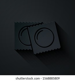 Paper cut Condoms in package safe sex icon isolated on black background. Safe love symbol. Contraceptive method for male. Paper art style. Vector Illustration
