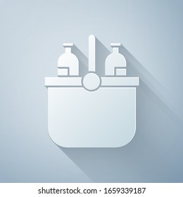 Paper cut Cooler bag and water icon isolated on grey background. Portable freezer bag. Handheld refrigerator. Paper art style. Vector Illustration