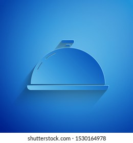 Paper cut Covered with a tray of food icon isolated on blue background. Tray and lid sign. Restaurant cloche with lid. Kitchenware symbol. Paper art style. Vector Illustration