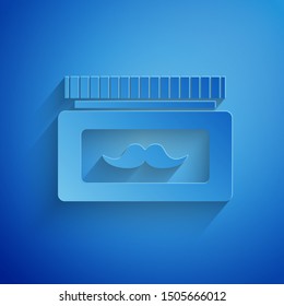 Paper cut Cream or lotion cosmetic jar icon isolated on blue background. Body care products for men. Paper art style. Vector Illustration