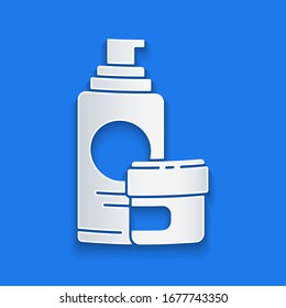 Paper cut Cream or lotion cosmetic tube icon isolated on blue background. Body care products for men. Paper art style. Vector Illustration