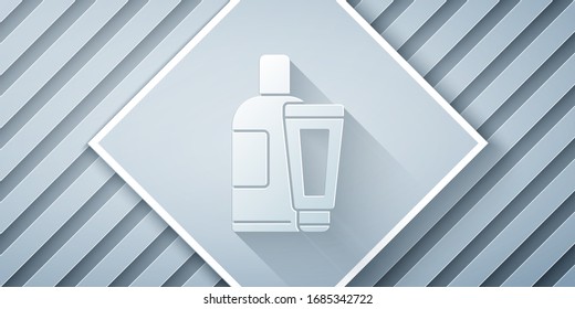 Paper cut Cream or lotion cosmetic tube icon isolated on grey background. Body care products for men. Paper art style. Vector Illustration