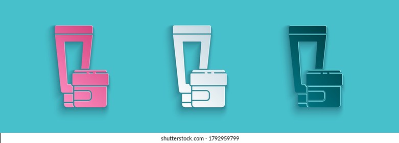 Paper cut Cream or lotion cosmetic tube icon isolated on blue background. Body care products for men. Paper art style. Vector Illustration