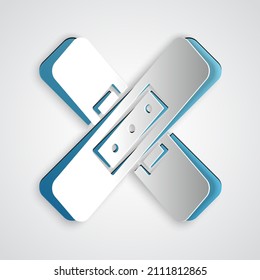 Paper cut Crossed bandage plaster icon isolated on grey background. Medical plaster, adhesive bandage, flexible fabric bandage. Paper art style. Vector Illustration