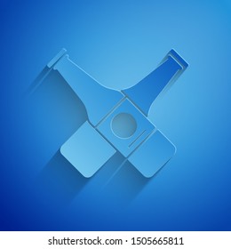 Paper cut Crossed beer bottle icon isolated on blue background. Paper art style. Vector Illustration