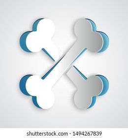 Paper cut Crossed bones icon isolated on grey background. Pets food symbol. Paper art style. Vector Illustration