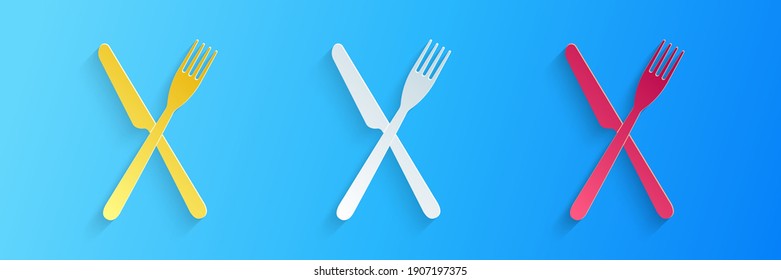 Paper cut Crossed fork and knife icon isolated on blue background. Restaurant icon. Paper art style. Vector.