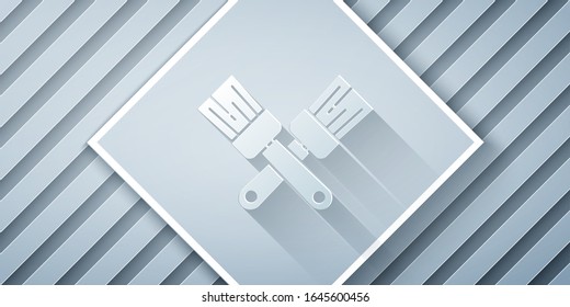 Paper cut Crossed paint brush icon isolated on grey background. Paper art style. Vector Illustration