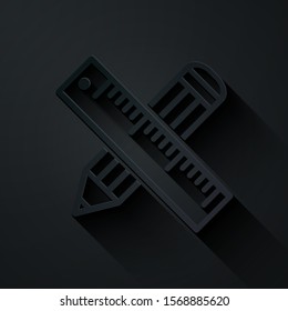 Paper cut Crossed ruler and pencil icon isolated on black background. Straightedge symbol. Drawing and educational tools. Paper art style. Vector Illustration