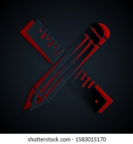 Paper cut Crossed ruler and pencil icon isolated on black background. Straightedge symbol. Drawing and educational tools. Paper art style. Vector Illustration