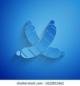 Paper cut Crossed sausage icon isolated on blue background. Grilled sausage and aroma sign. Paper art style. Vector Illustration