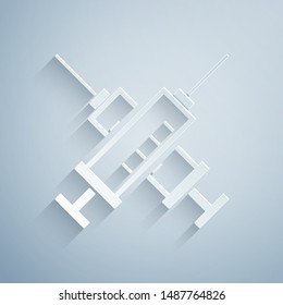Paper cut Crossed syringe icon isolated on grey background. Syringe for vaccine, vaccination, injection, flu shot. Medical equipment. Paper art style. Vector Illustration