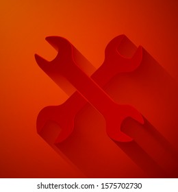 Paper cut Crossed wrenchs icon isolated on red background. Spanner repair tool. Service tool symbol. Paper art style. Vector Illustration