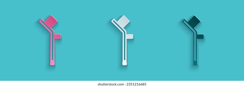 Paper cut Crutch or crutches icon isolated on blue background. Equipment for rehabilitation of people with diseases of musculoskeletal system. Paper art style. Vector